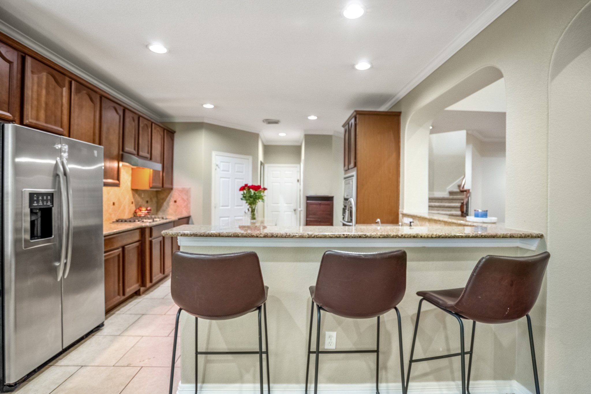 10410 Pitcataway Drive Spring, TX 77379 - Photo 12 of 48 The breakfast bar offers a convenient space to enjoy a light snack or to serve your guests when hosting parties.