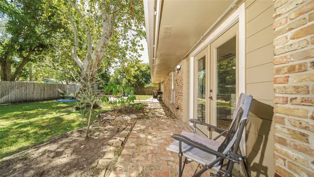 a view of yard with patio