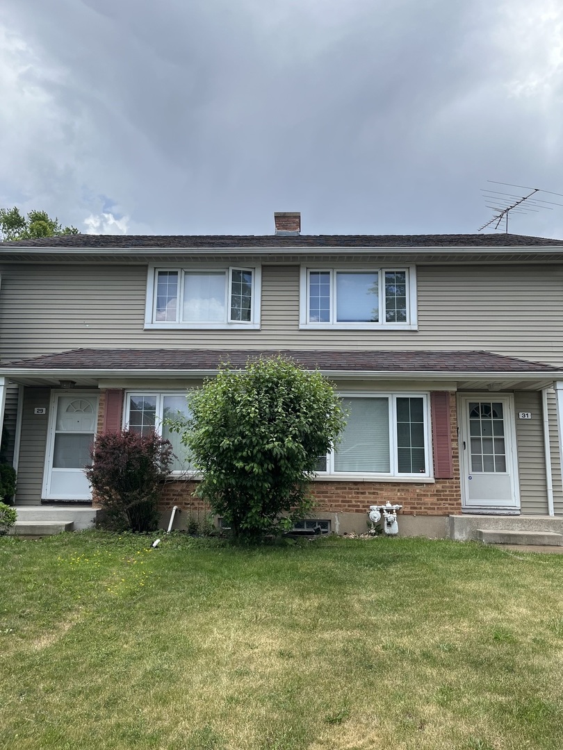 31 Krotiak Road Park Forest, IL 60466 - Photo 1 of 15 a front view of a house with a garden