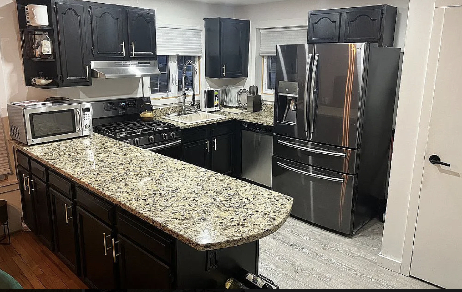 31 Krotiak Road Park Forest, IL 60466 - Photo 7 of 15 a kitchen with stainless steel appliances kitchen island granite countertop a refrigerator stove and oven