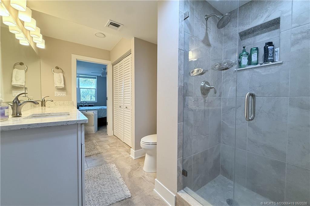 1950 Southwest Palm City Road, Unit 14305 Stuart, FL 34994 - Photo 44 of 70 a bathroom with a sink a toilet and shower