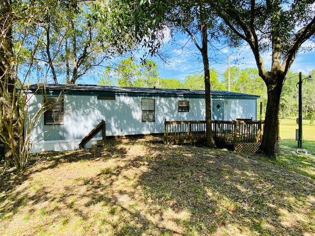 96142 Lang Road Yulee, FL 32097 - Photo 14 of 15 a view of a backyard of the house