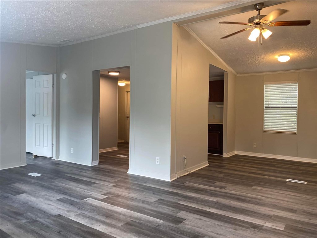 96142 Lang Road Yulee, FL 32097 - Photo 4 of 15 a view of an empty room with window and wooden floor