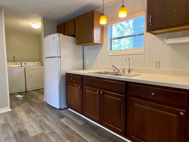 96142 Lang Road Yulee, FL 32097 - Photo 5 of 15 a kitchen with a refrigerator and a sink