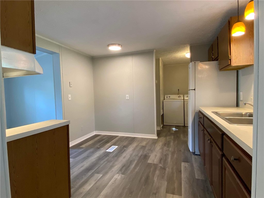 96142 Lang Road Yulee, FL 32097 - Photo 6 of 15 a view of a kitchen with cabinets and wooden floor