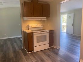 96142 Lang Road Yulee, FL 32097 - Photo 7 of 15 a view of a kitchen with wooden floor and a sink