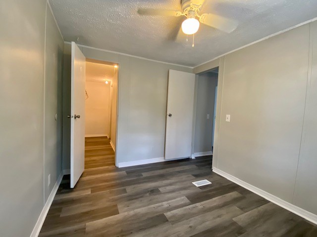 96142 Lang Road Yulee, FL 32097 - Photo 10 of 15 an empty room with wooden floor and door