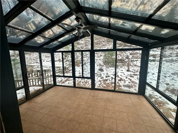 a view of an empty room with a balcony