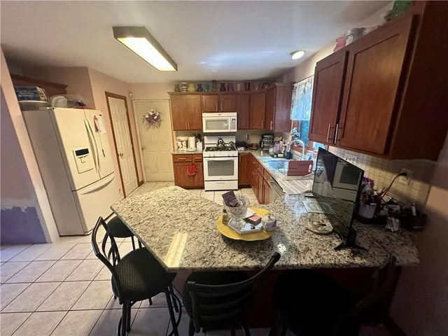 a kitchen with a table and chairs in it