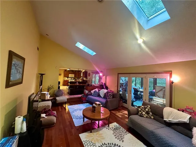 a living room with furniture and a rug