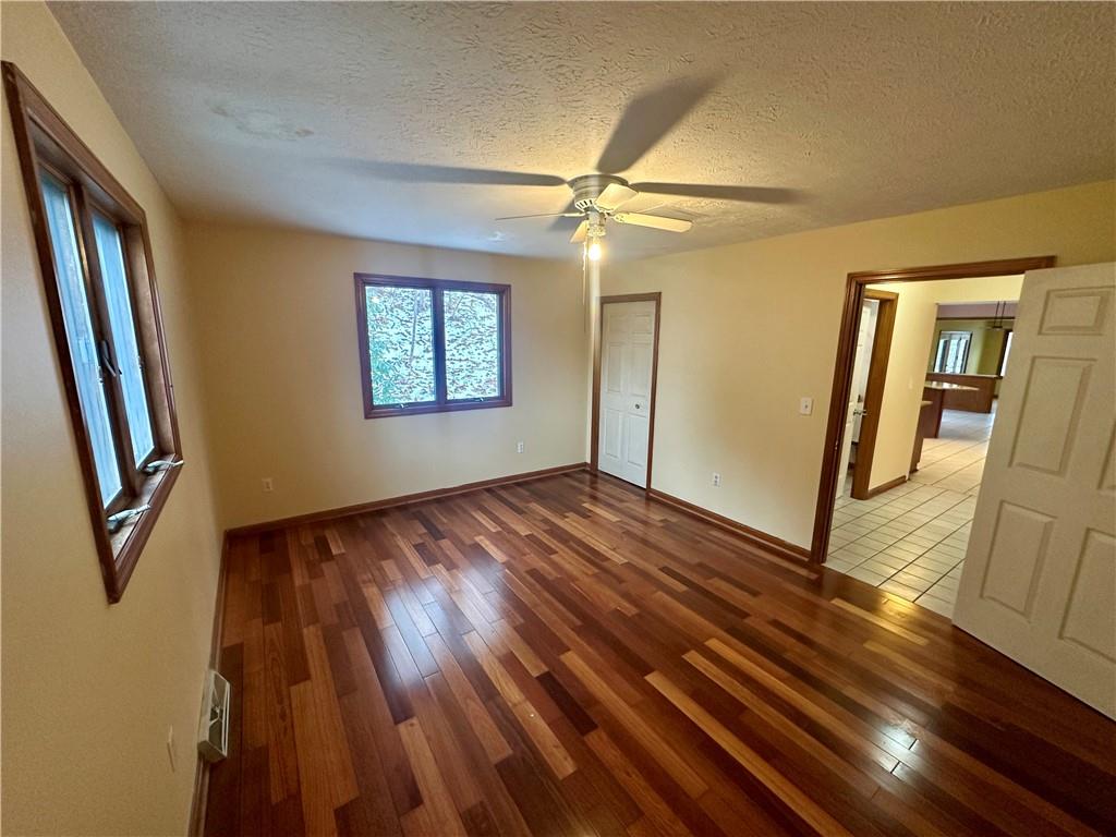 513 Sandra Lane Cheswick, PA 15024 - Photo 27 of 49 wooden floor in an empty room with a window