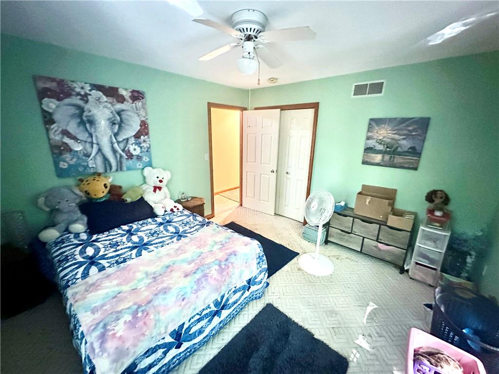 513 Sandra Lane Cheswick, PA 15024 - Photo 27 of 48 a bedroom with a bed and a chandelier