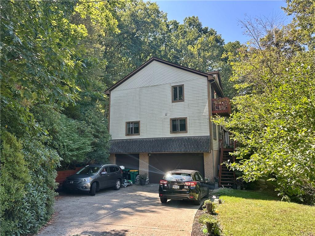 513 Sandra Lane Cheswick, PA 15024 - Photo 3 of 48 a view of a car parked in front of a house