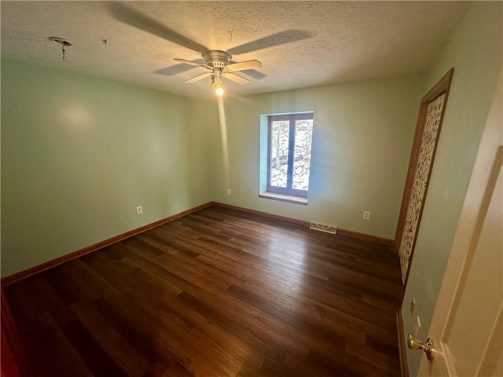513 Sandra Lane Cheswick, PA 15024 - Photo 31 of 49 a view of an empty room with a window and wooden floor
