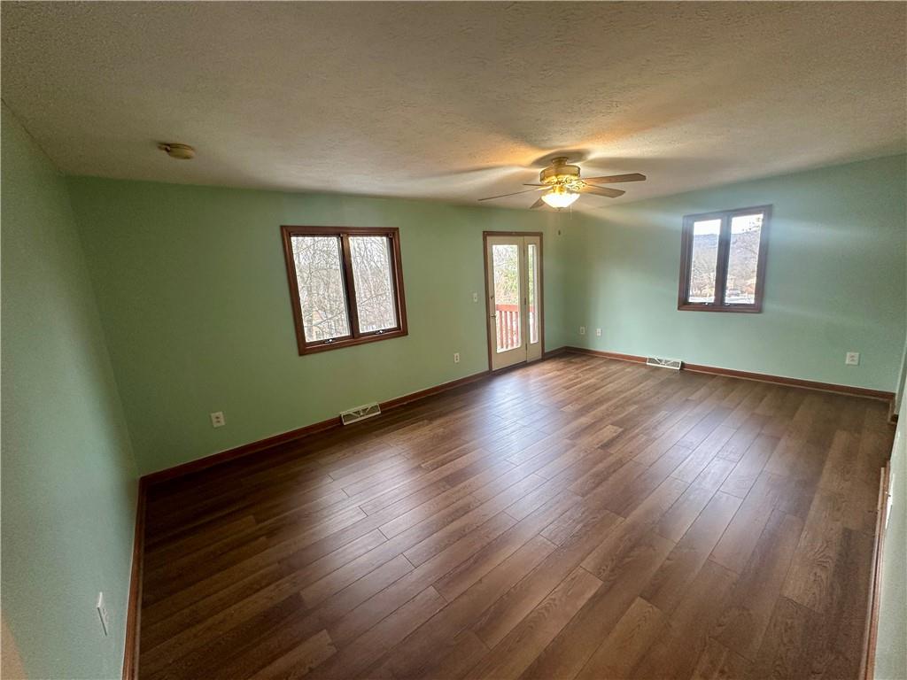 513 Sandra Lane Cheswick, PA 15024 - Photo 36 of 49 a view of an empty room with wooden floor and a window
