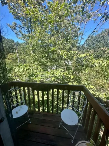 a bed room with furniture and a flat screen tv
