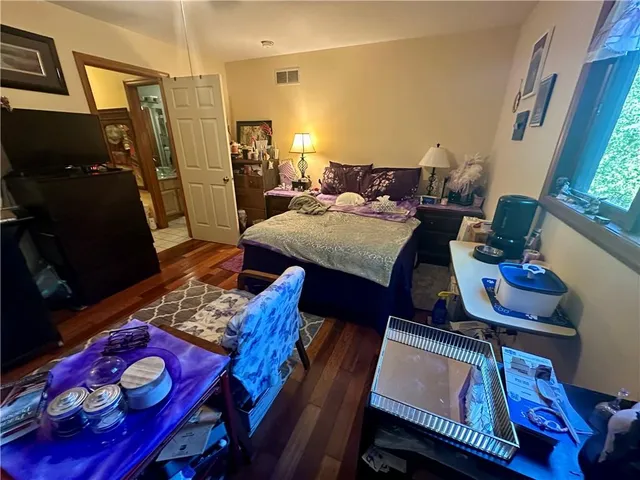 a big yard with lots of green space and trees