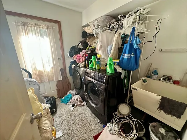 a backyard of a house with lots of green space and fountain