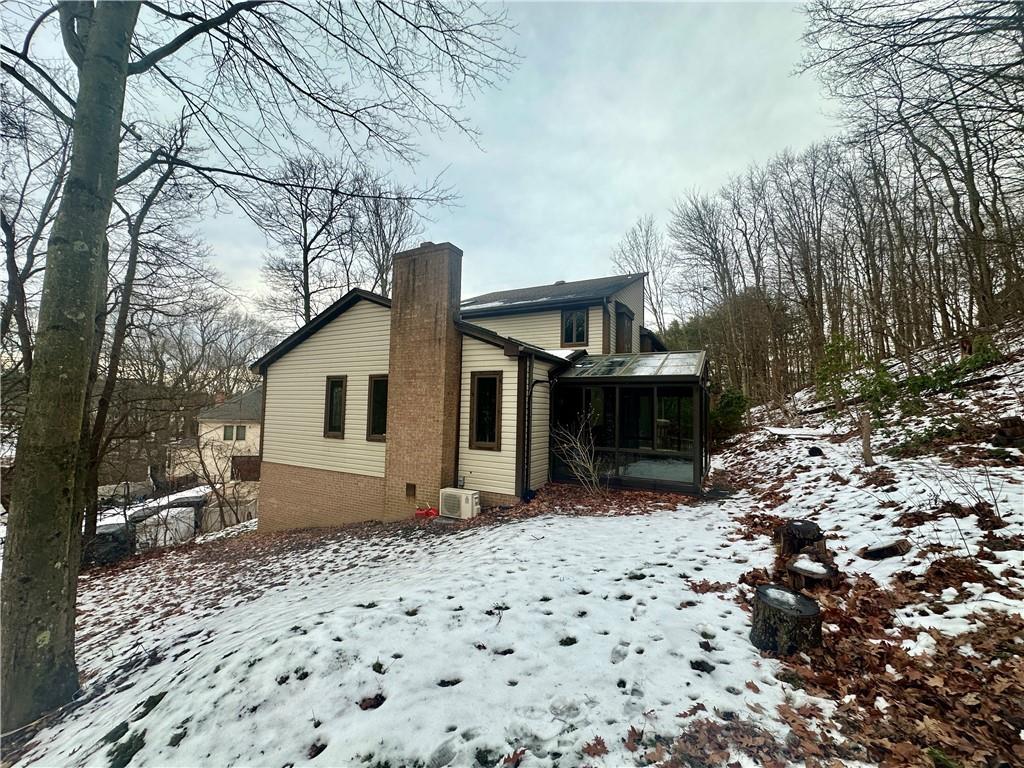 513 Sandra Lane Cheswick, PA 15024 - Photo 47 of 49 a view of a house with a bench in a backyard