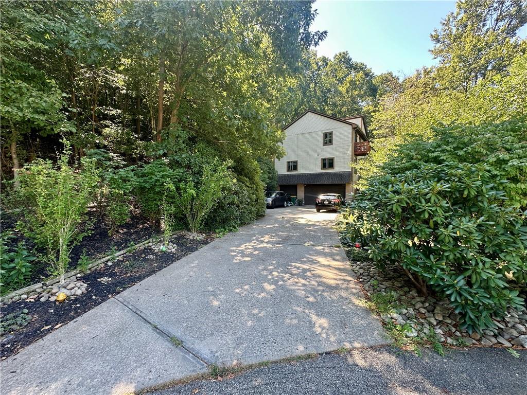 513 Sandra Lane Cheswick, PA 15024 - Photo 5 of 48 a front view of a house with a yard and trees