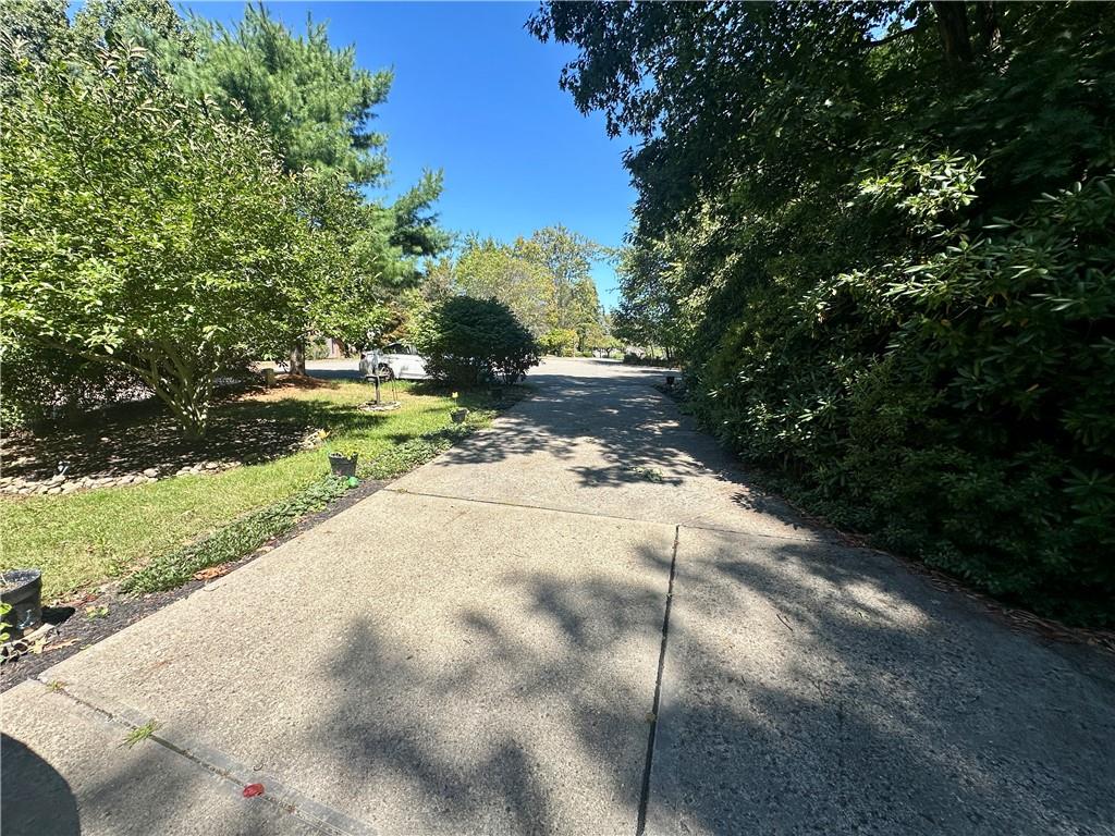 513 Sandra Lane Cheswick, PA 15024 - Photo 7 of 48 a view of a yard with plants and trees