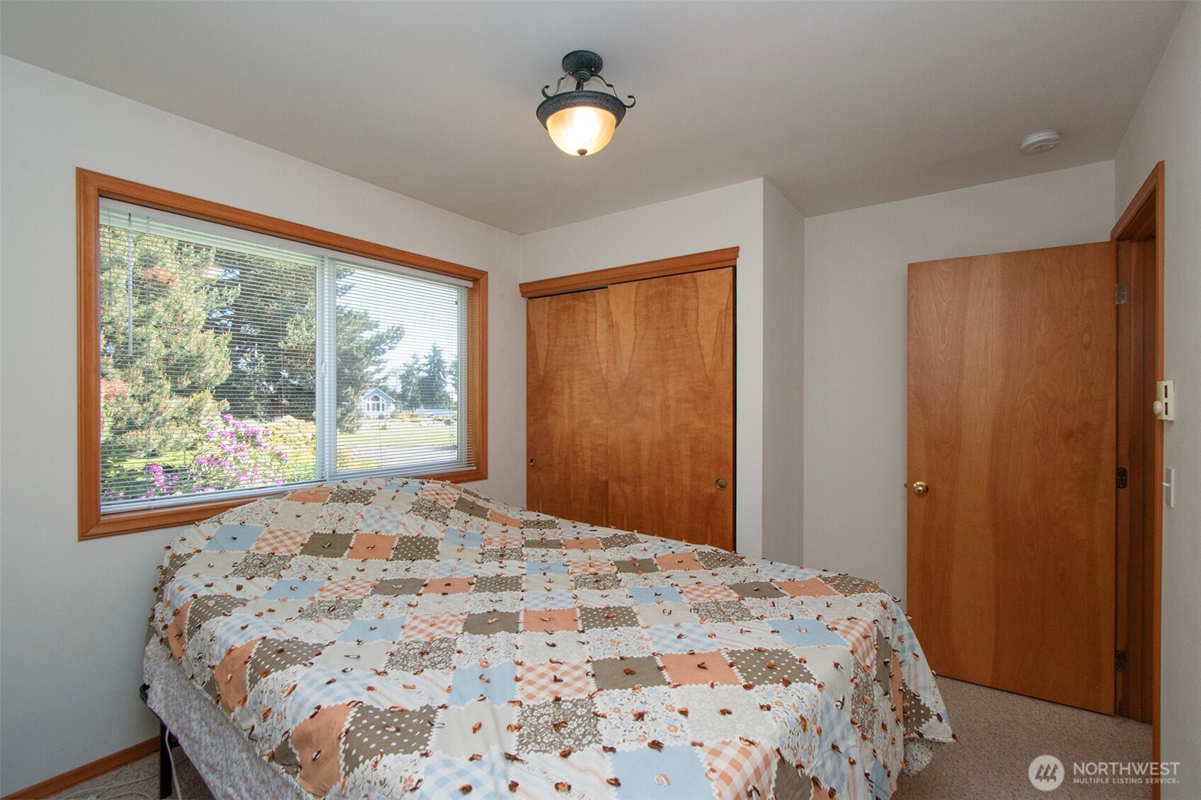 101 Timothy Lane Sequim, WA 98382 - Photo 20 of 39 a bedroom with a bed and a window