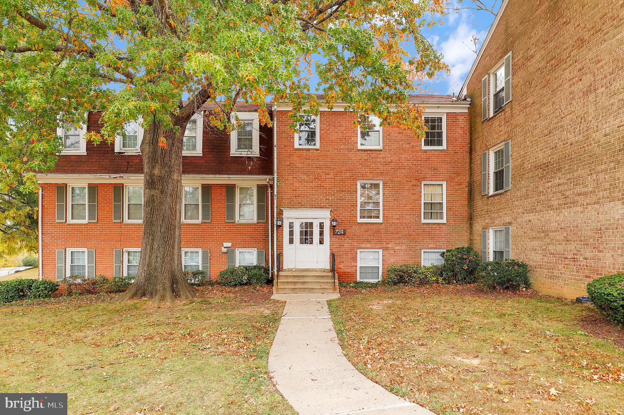 a view of a brick house with many windows