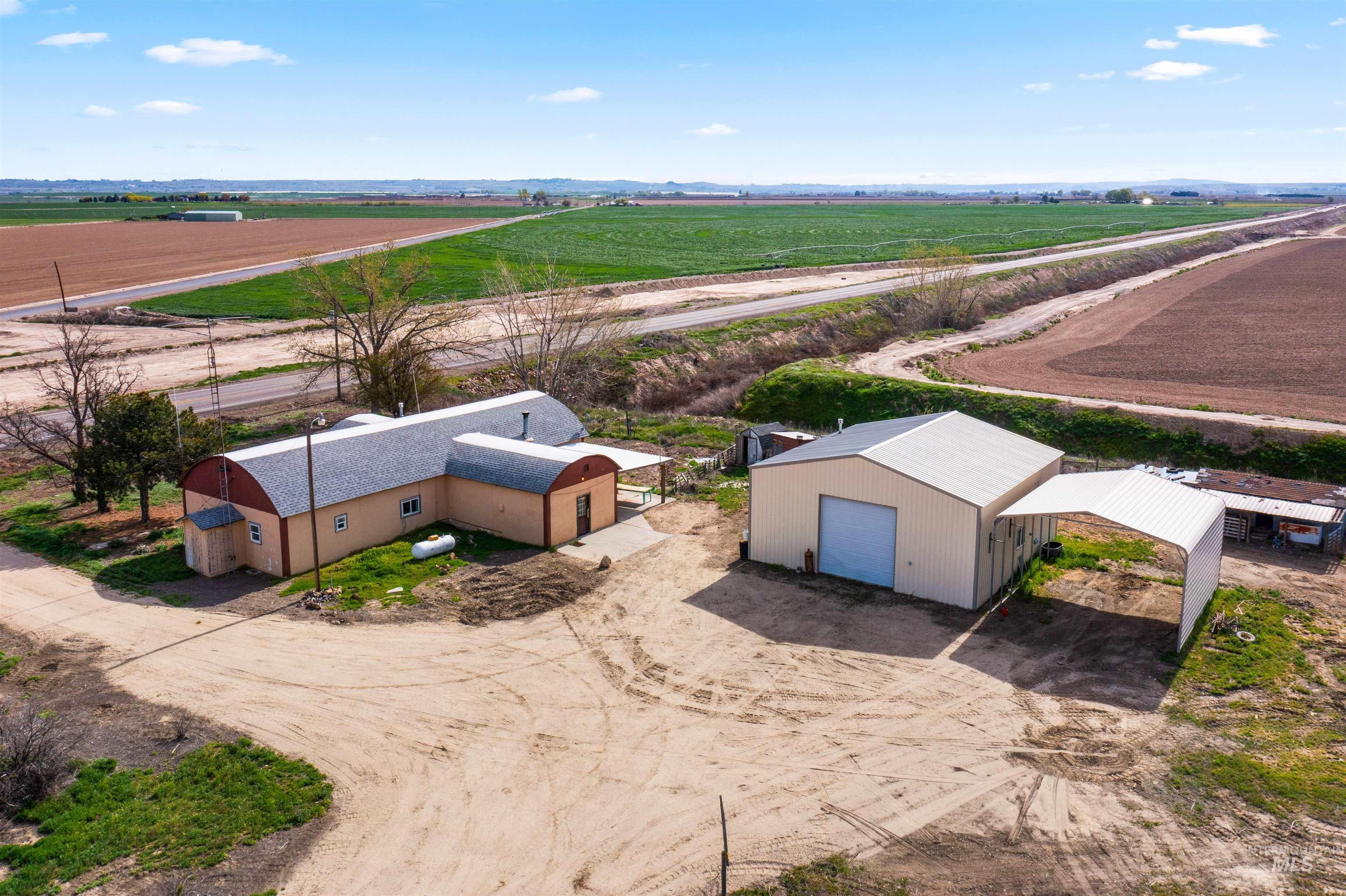 5168 South Jump Creek Road Marsing, ID 83639 - Photo 1 of 40 Aerial view of sparsely populated area featuring farmland and a mountain backdrop