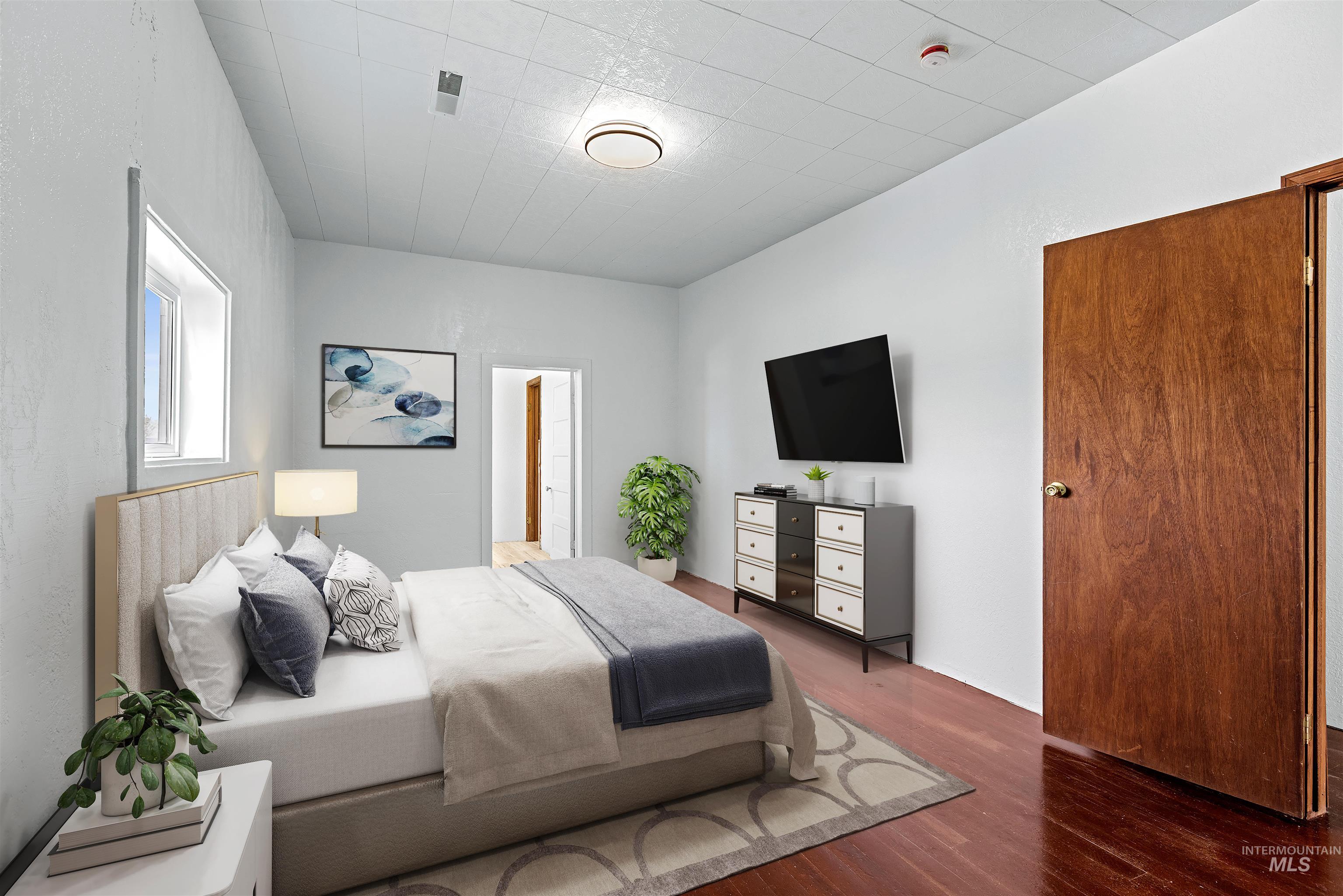 5168 South Jump Creek Road Marsing, ID 83639 - Photo 23 of 40 Bedroom featuring wood finished floors