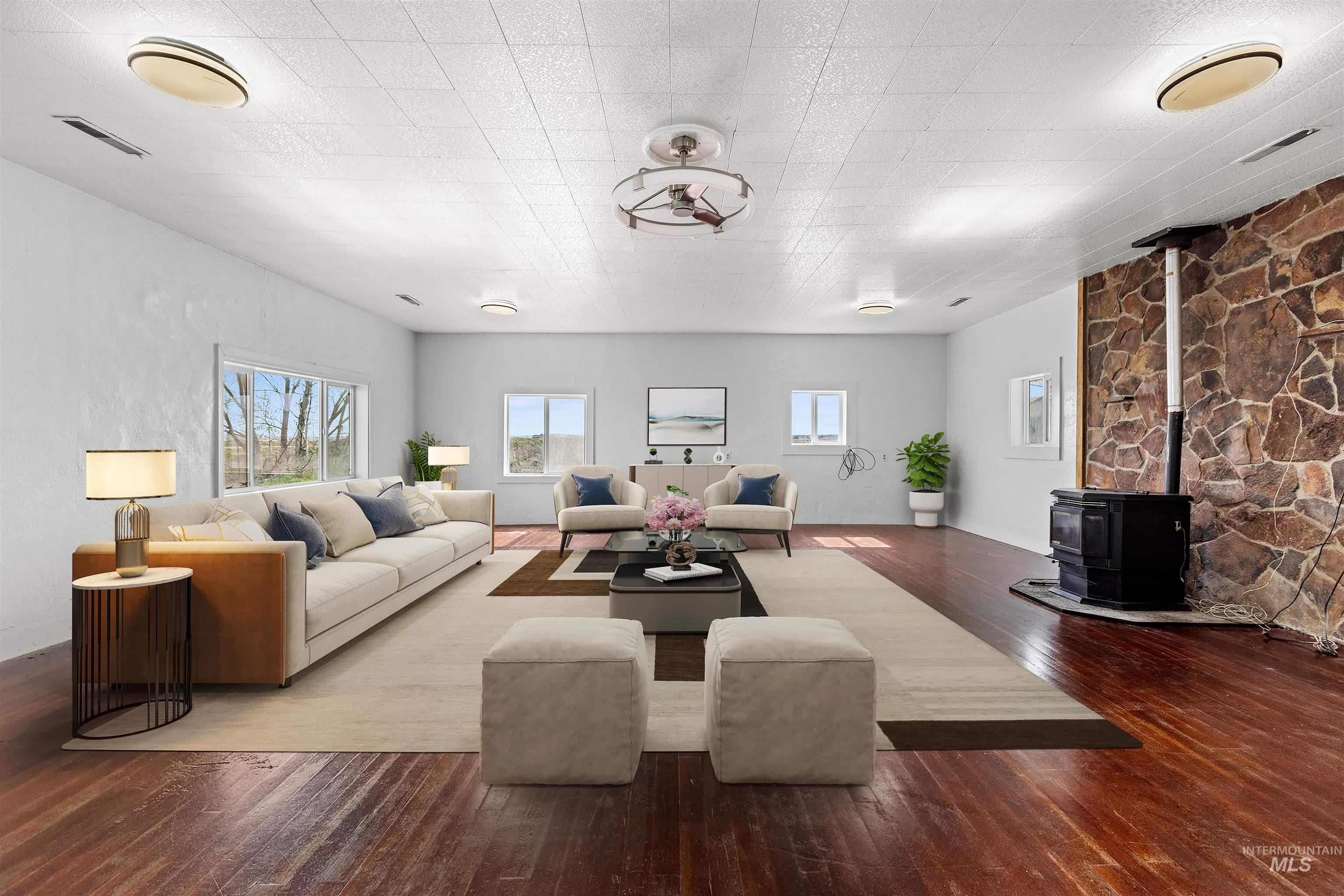 5168 South Jump Creek Road Marsing, ID 83639 - Photo 8 of 40 Living room with a wood stove and dark wood-style flooring