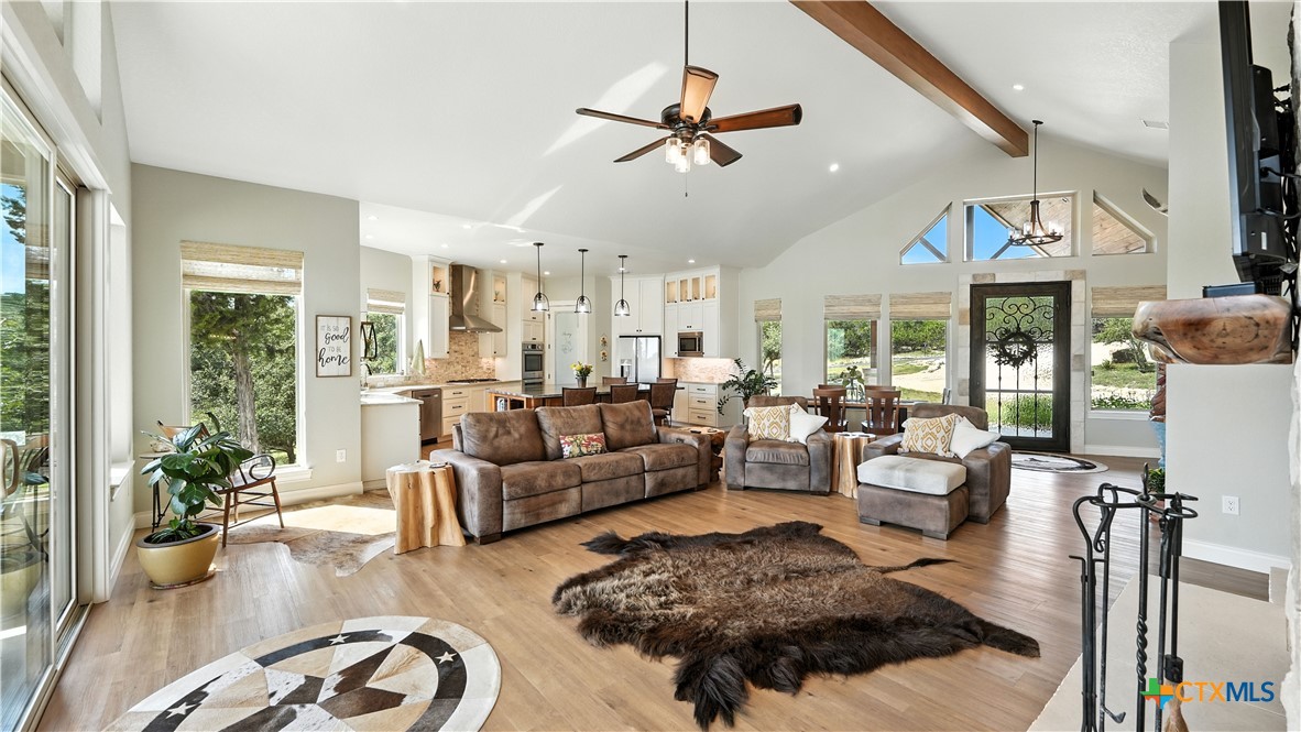 134 Stallion Estates Drive Spring Branch, TX 78070 - Photo 15 of 48 a living room with furniture ceiling fan and a window