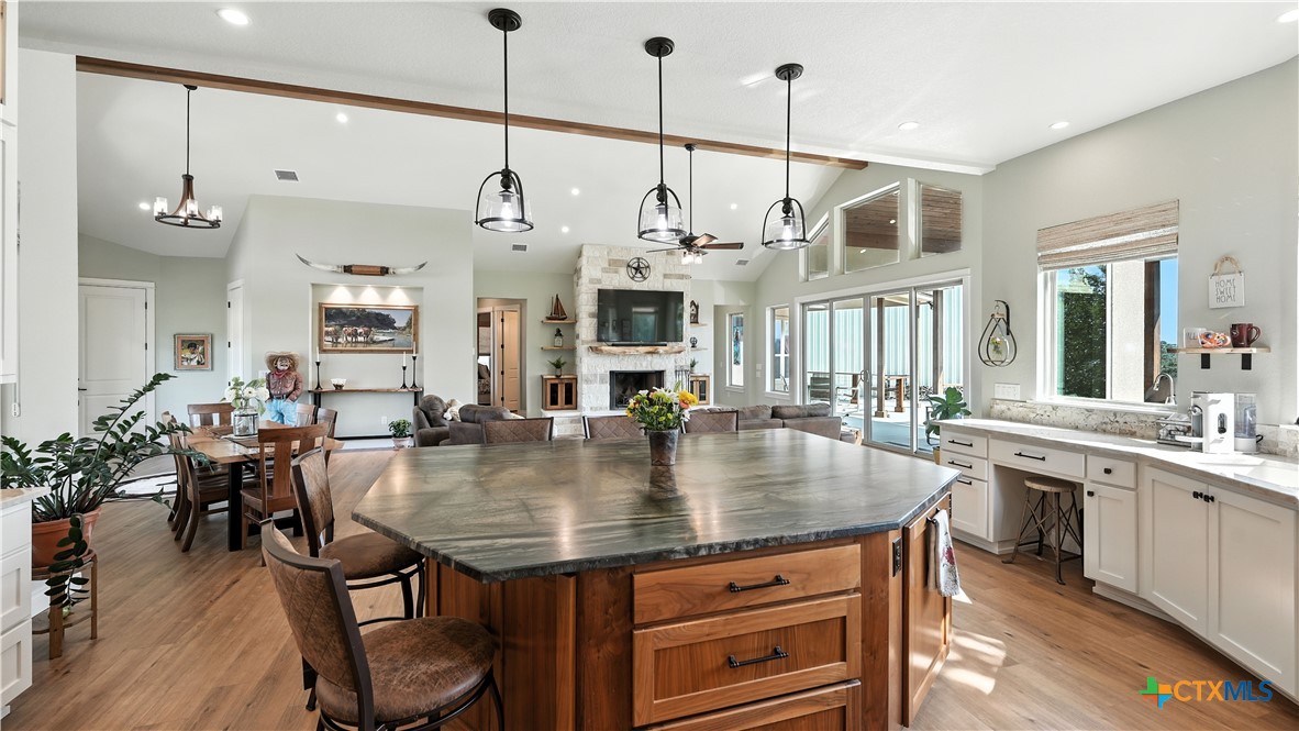 134 Stallion Estates Drive Spring Branch, TX 78070 - Photo 18 of 48 a view of a dining room and livingroom with furniture wooden floor a chandelier