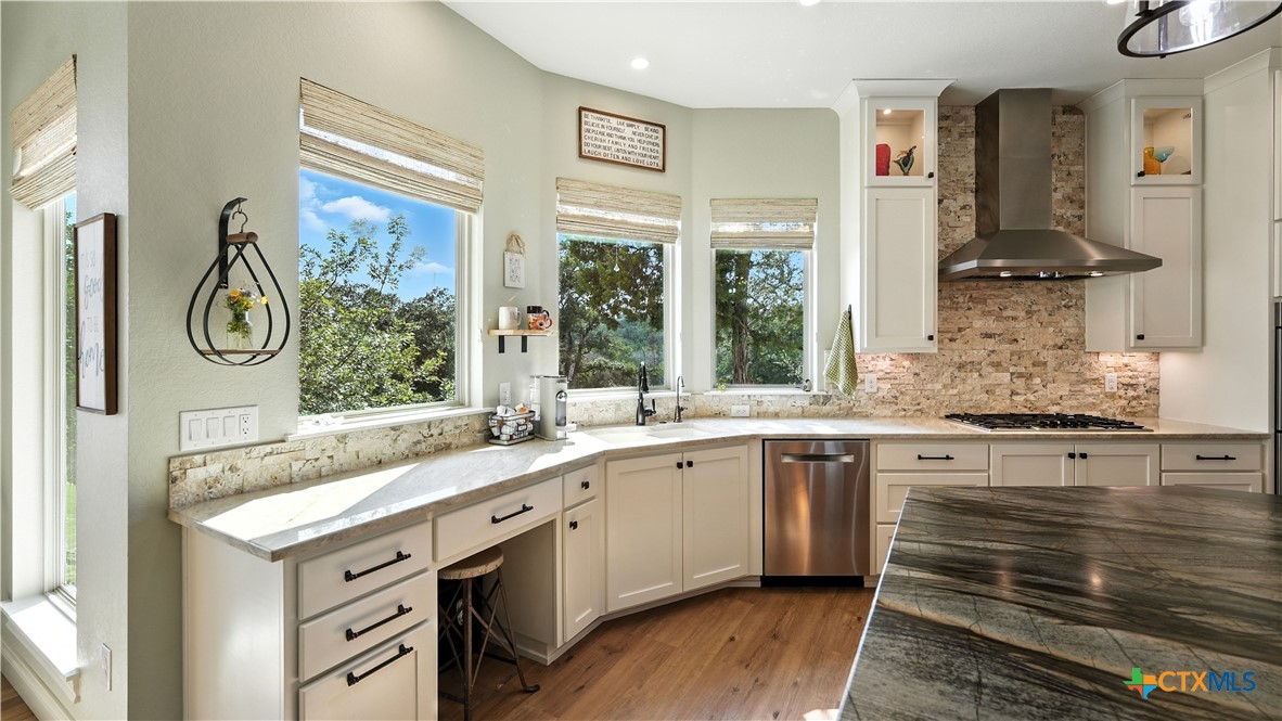 134 Stallion Estates Drive Spring Branch, TX 78070 - Photo 20 of 48 a spacious bathroom with a granite countertop sink and a window
