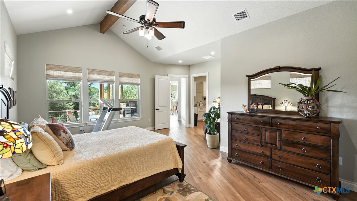 134 Stallion Estates Drive Spring Branch, TX 78070 - Photo 28 of 48 a bed room with a bed mirror and a window