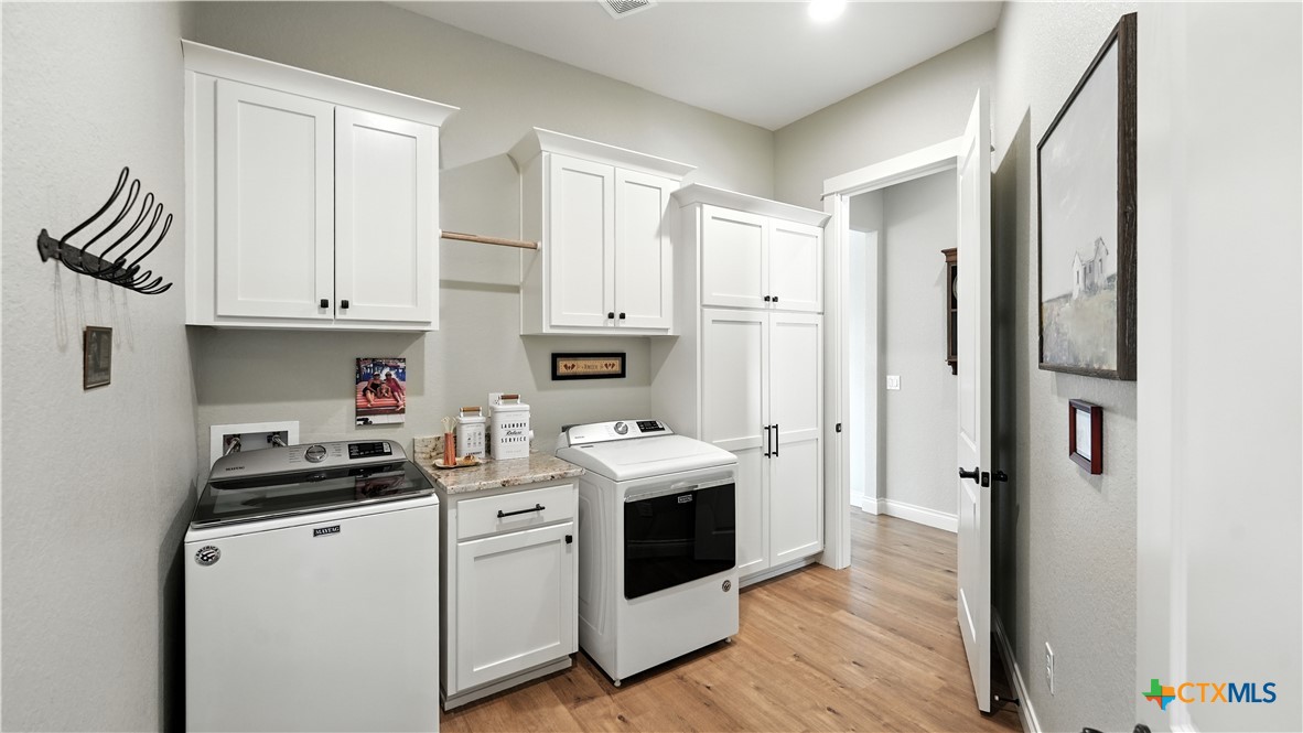 134 Stallion Estates Drive Spring Branch, TX 78070 - Photo 33 of 48 a kitchen with stainless steel appliances granite countertop a stove and a refrigerator