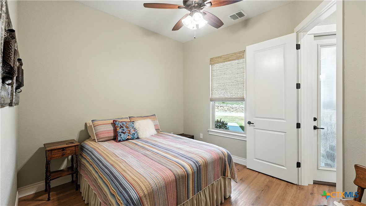 134 Stallion Estates Drive Spring Branch, TX 78070 - Photo 37 of 48 a bedroom with a bed and a window