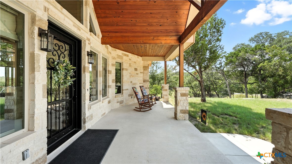 134 Stallion Estates Drive Spring Branch, TX 78070 - Photo 40 of 48 a view of a porch with garden