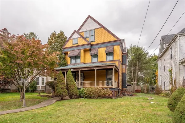 a front view of a house with a yard