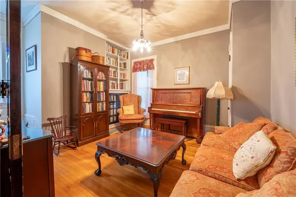 a bedroom with furniture and a chandelier