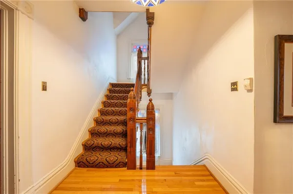 a view of entryway with wooden floor