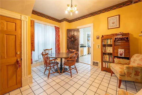 a dining room with furniture and window