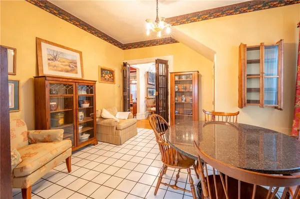 a very nice looking living room with a large window and furniture