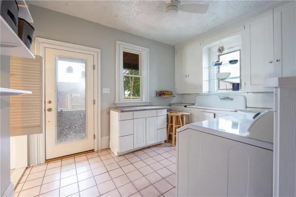 a kitchen that has a sink and a stove in it