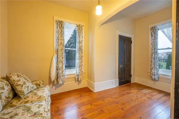 a view of front door with wooden floor