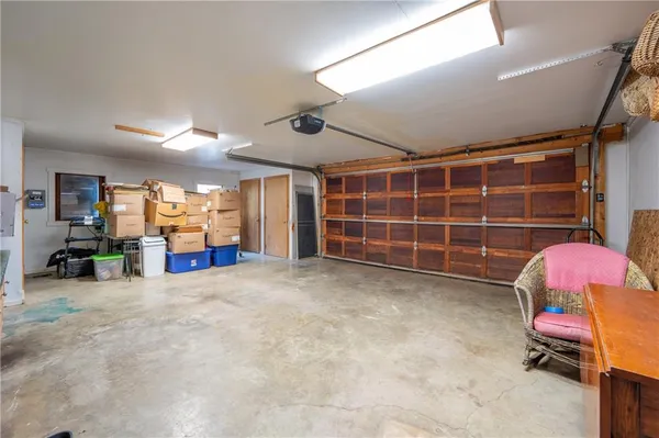 a view of a room with gym equipment and a large window
