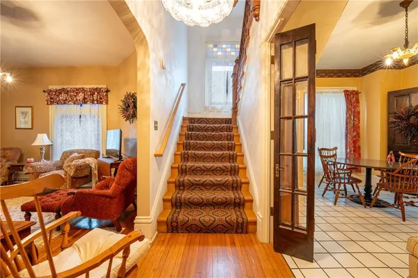 a view of entryway and hall with wooden floor