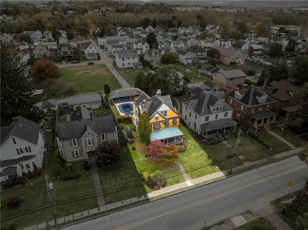 an aerial view of a house with a garden
