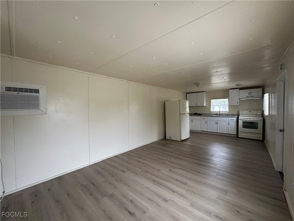 8376 Nault Road North Fort Myers, FL 33917 - Photo 2 of 10 a view of a kitchen with a sink and a stove top oven