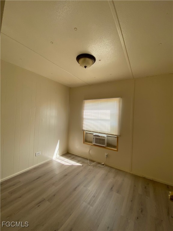 8376 Nault Road North Fort Myers, FL 33917 - Photo 7 of 10 a view of empty room with wooden floor