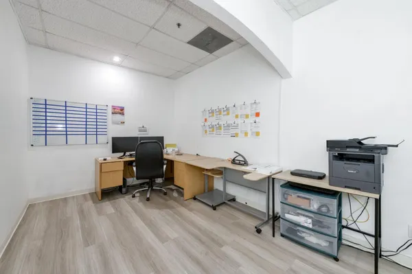 a view of a workspace with furniture